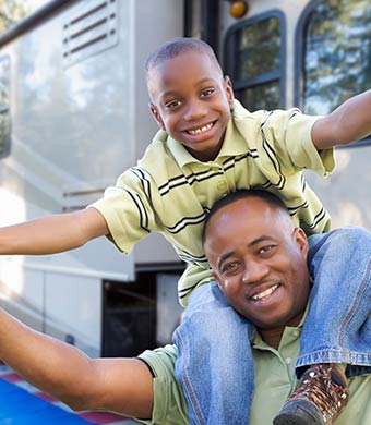 Father and Son with RV